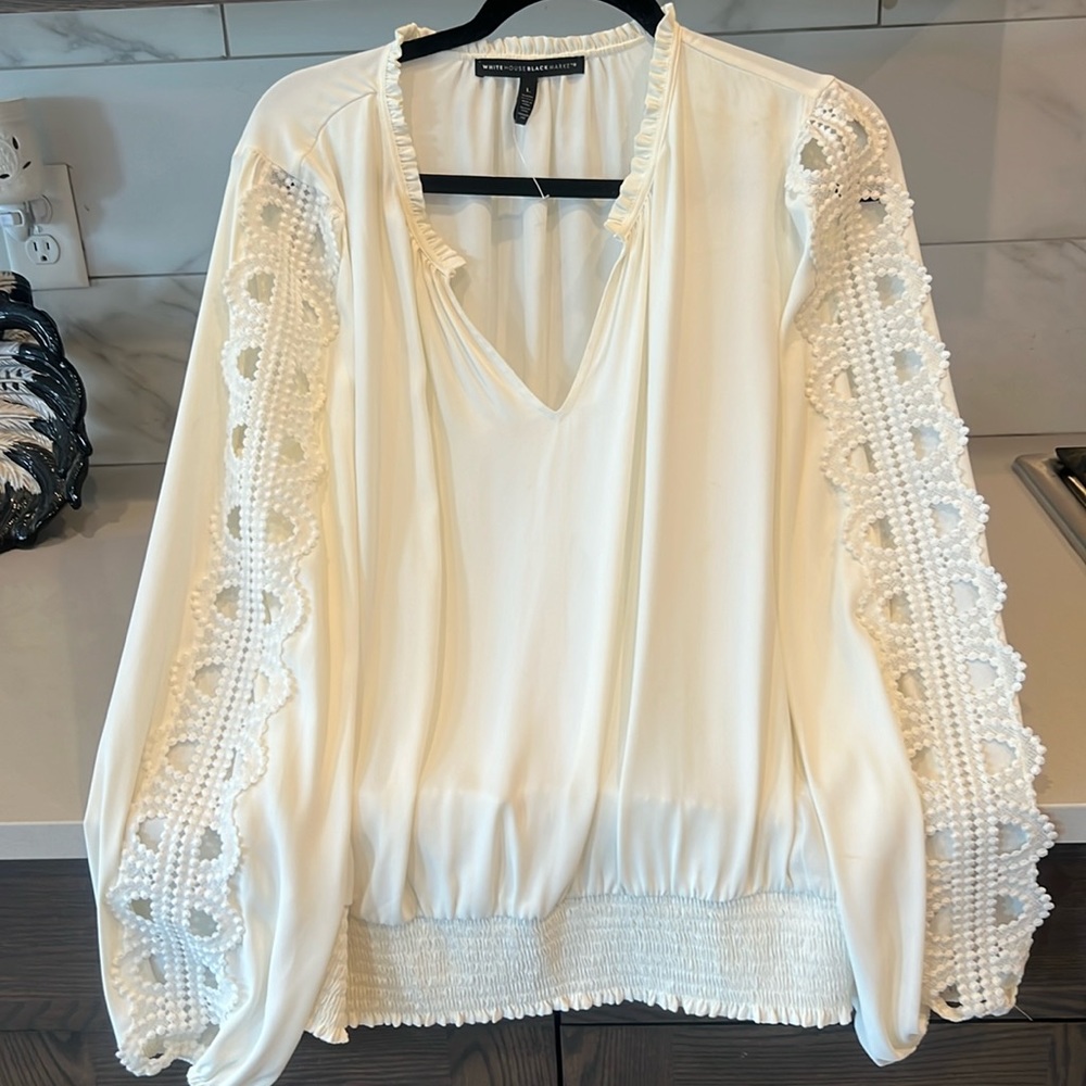 White House black market blouse with smocked waist. Beautiful cutout sleeves.